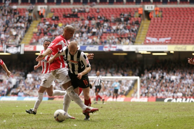 Andy Parkinson appears to be brought down in the penalty area.