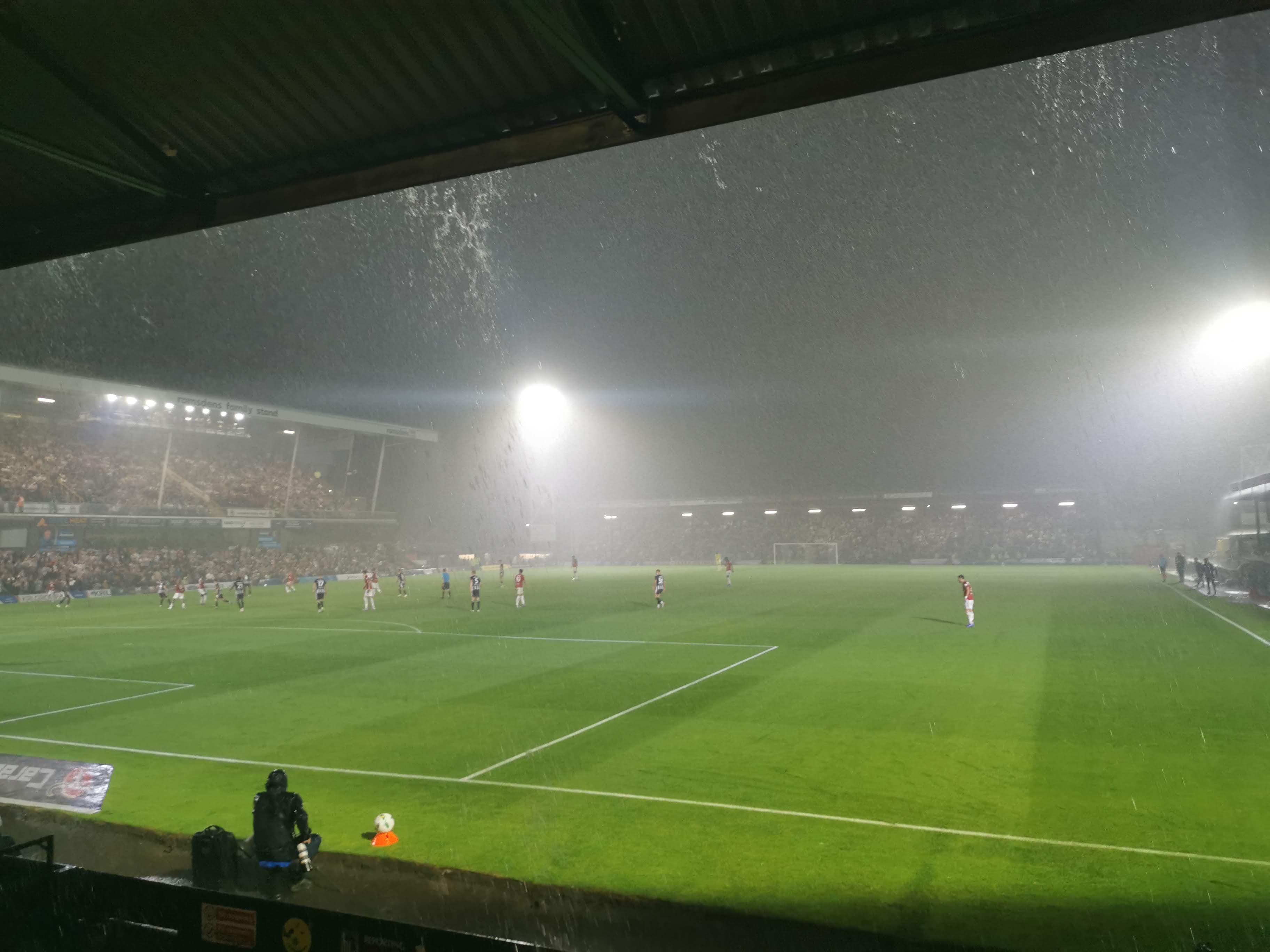 The torrential rain falls in the cup tie between Grimsby Town and Manchester United